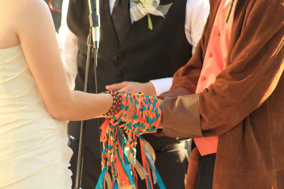 Some couples literally tie the knot as they participate in handfasting during the wedding ceremony. Photo by Ruth Madeleine 