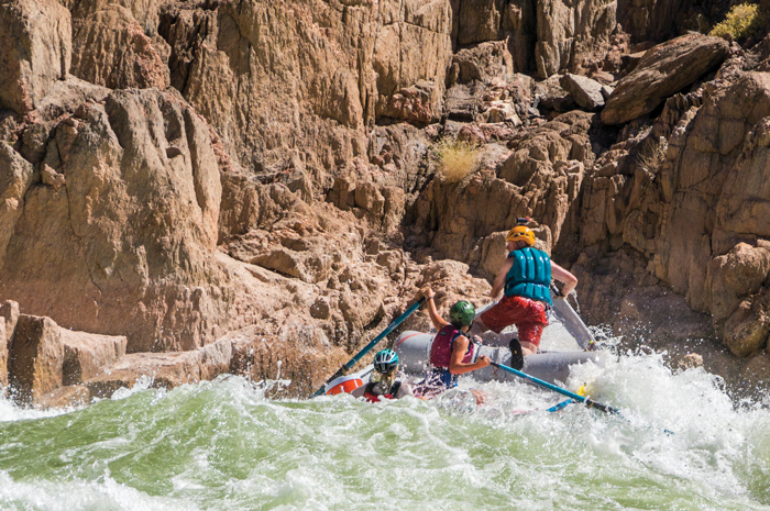 Kayla R. rows Granite Rapid with passengers Sharai and Mitch C. Photo by Craig Shelley.